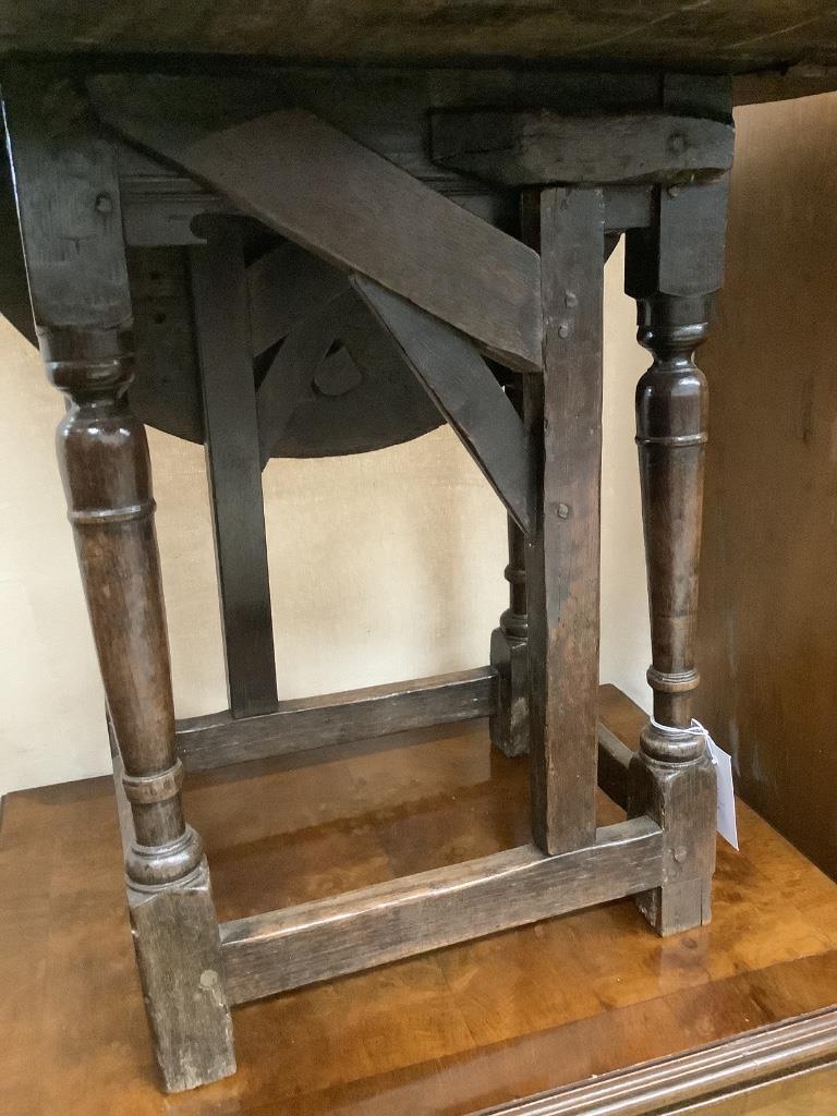 An early oak gateleg occasional table, width 60cm, depth 29cm, height 53cm